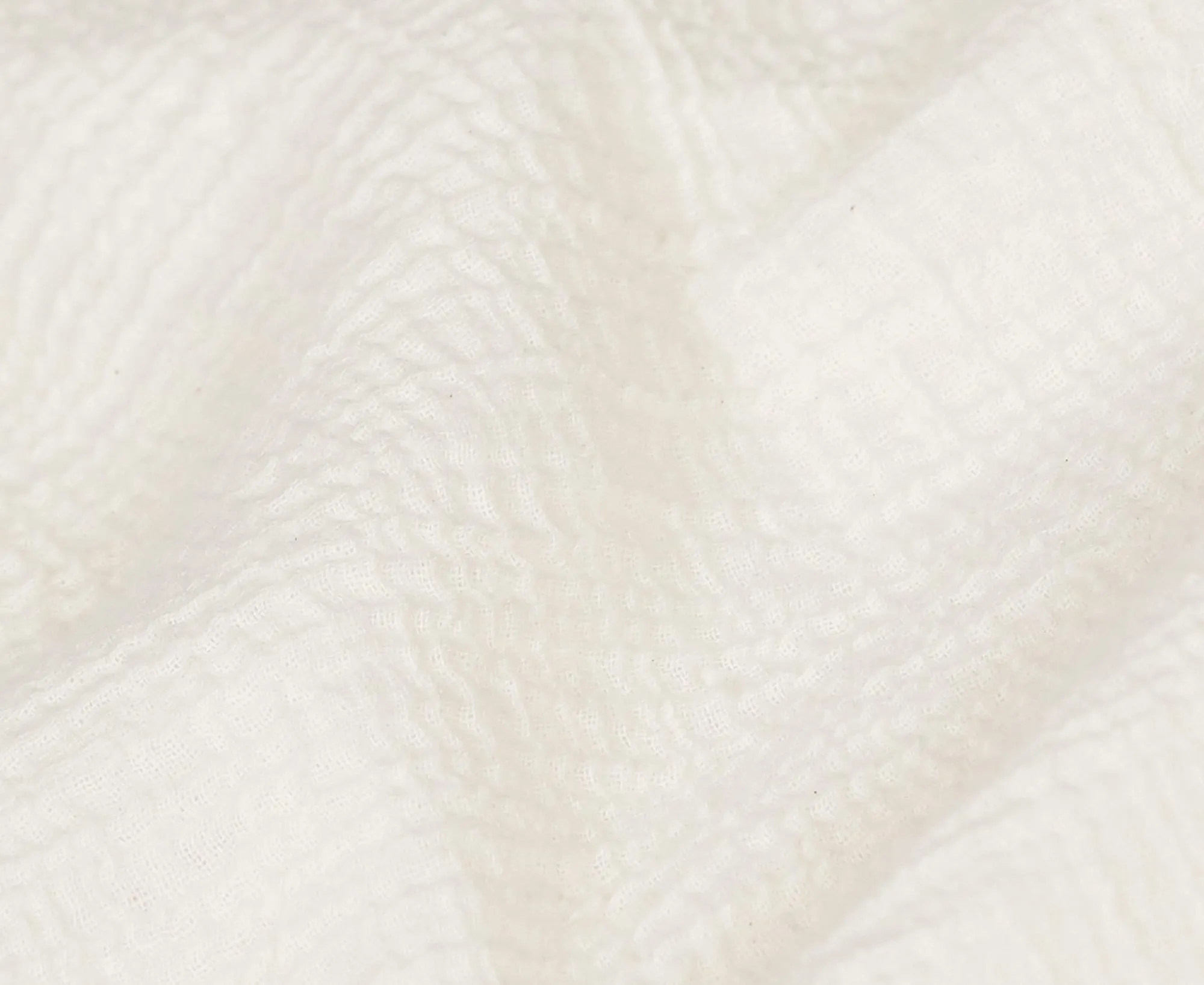 Gros plan sur la texture de la gaze de coton gaufrée